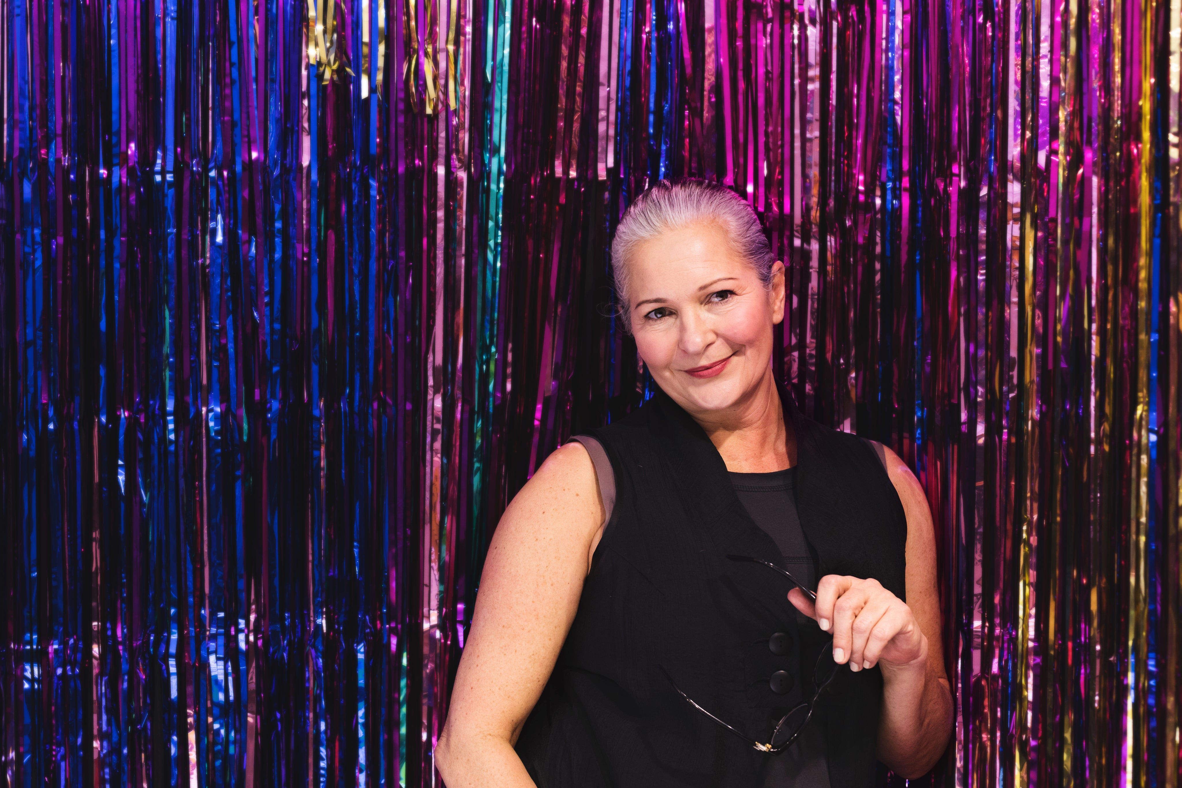 files/woman-in-front-of-multicolored-background.jpg